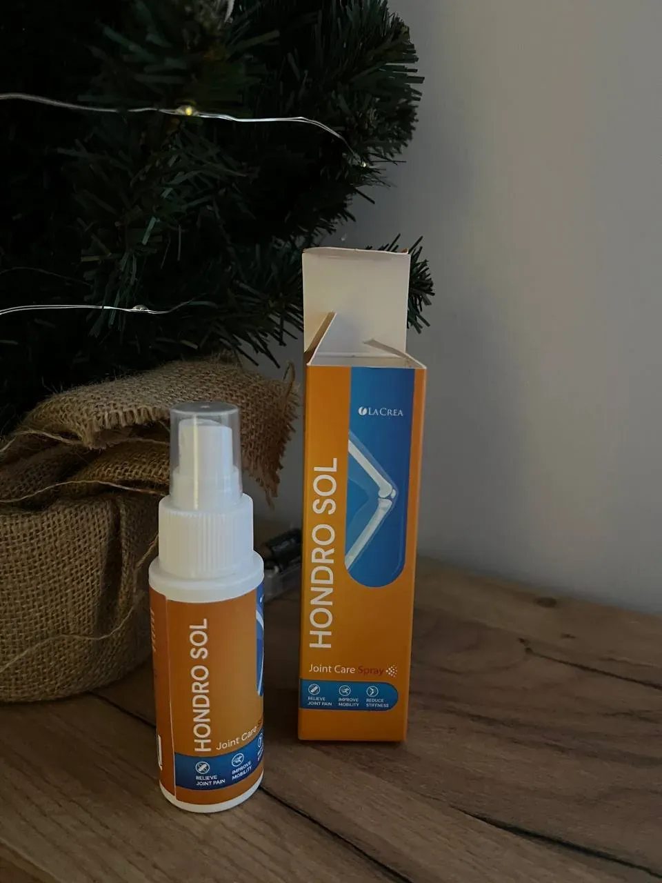 Frasco pulverizador de Hondro Sol junto a su caja abierta